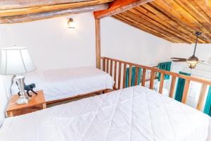 Voodi või voodid majutusasutuse Hacienda La Norma Boho Boutique Hotel toas