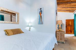Voodi või voodid majutusasutuse Hacienda La Norma Boho Boutique Hotel toas