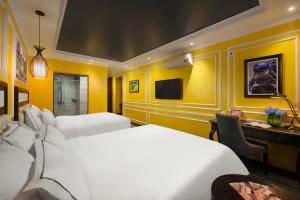 Postel nebo postele na pokoji v ubytování Eden Central Hotel & Spa