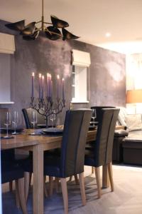 a dining room with a table with chairs and a dining room at Cornish country getaway in Callington