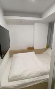 Ένα ή περισσότερα κρεβάτια σε δωμάτιο στο T A B Hotel