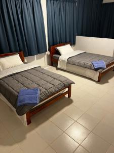 Postel nebo postele na pokoji v ubytování LUMUN Holiday Home Rental + 34 fotografií