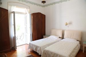 Un pat sau paturi într-o cameră la Villa Melina