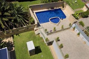 an overhead view of a swimming pool in a yard at Sandy Cove Apartment The Entrance 29 in The Entrance