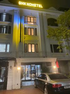 a car parked in front of a building at Gia Hưng Khang Hometel in Ha Long