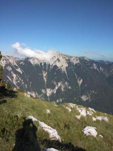 a view of a mountain range with clouds in the sky at Apartman Prenj in Konjic