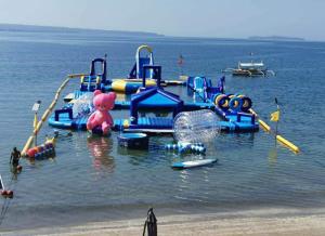 a water park with a bunch of equipment in the water at PALM TREE RESORT AND RESTAURANT in Olongapo