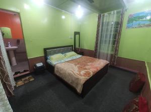 a bedroom with a large bed and a bathroom at LakeSide Homestay Srinagar in Srinagar