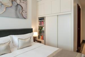 Uma cama ou camas num quarto em Somerset Al Mansoura Doha