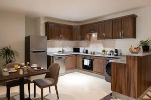 A cozinha ou kitchenette de Somerset Al Mansoura Doha