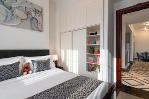 Uma cama ou camas num quarto em Somerset Al Mansoura Doha