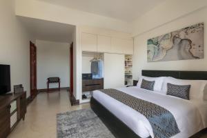 Uma cama ou camas num quarto em Somerset Al Mansoura Doha