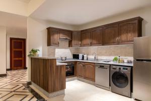 A cozinha ou kitchenette de Somerset Al Mansoura Doha