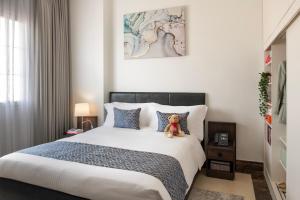 Uma cama ou camas num quarto em Somerset Al Mansoura Doha