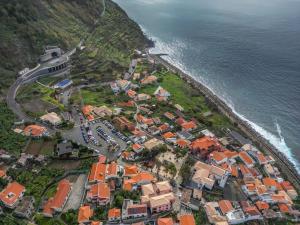 an aerial view of a village next to the ocean at SolMar in Jardim do Mar