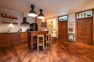 A kitchen or kitchenette at Le Rendezvous Apartments New Town