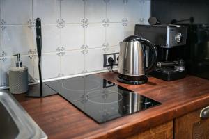 A kitchen or kitchenette at Le Rendezvous Apartments New Town