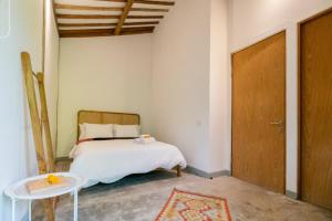 מיטה או מיטות בחדר ב-Singgah di Ubud 2