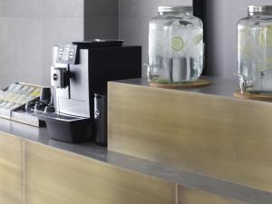 a counter with two jars and a coffee maker on it at HOTEL THE LEBEN OSAKA in Osaka