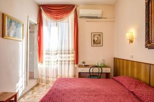 Postel nebo postele na pokoji v ubytování Giovy + 27 fotografií