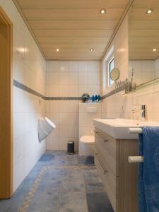 a bathroom with a sink and a toilet at Fewo am Hochscheid in Sankt Ingbert