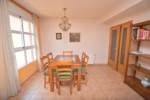 a dining room with a table and chairs at Apartamento La Senia in Jávea