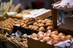 a display of donuts and other pastries in a bakery at The Ritz-Carlton Abu Dhabi, Grand Canal in Abu Dhabi