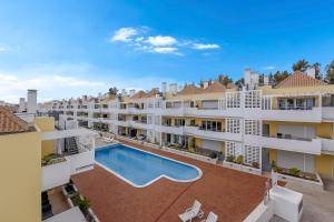 an aerial view of an apartment complex with a swimming pool at Penthouse Papoila in Cabanas de Tavira