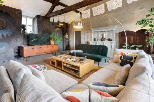 a living room with a couch and a table at The Colour House, Kendal Getaway in Kendal