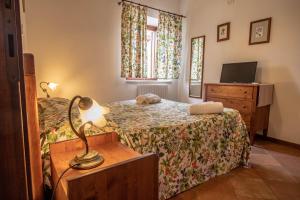Postel nebo postele na pokoji v ubytování Antico Borghetto - Casa Vacanze