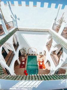 a view from the top of a house with a swimming pool at Riad Eldar in Marrakesh