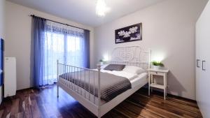 Postel nebo postele na pokoji v ubytování Apartments of Pawia