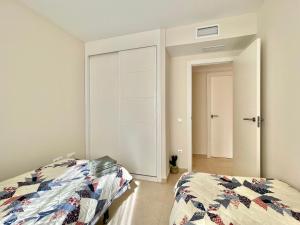 Postel nebo postele na pokoji v ubytování 2 Bedrooms Apartment in Calpe LARIMAR