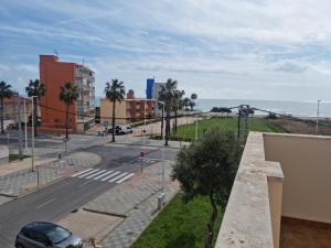 a view of a street and the ocean from a building at Pareado Mediterrania in Benicarló