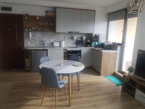 A kitchen or kitchenette at QUEEN'S VIEW app-9 free pool,parking, fitness & sea view
