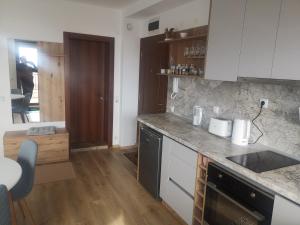 A kitchen or kitchenette at QUEEN'S VIEW app-9 free pool,parking, fitness & sea view