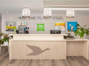 an office with a reception desk with a bird on it at Ibis Styles The Entrance in The Entrance
