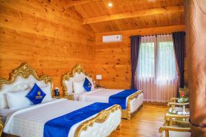 Postel nebo postele na pokoji v ubytování Tea Resort