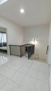 a room with a staircase and a white tile floor at Homestay Nilai D'Jati in Nilai