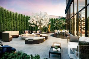 a patio with couches and a fire pit in a building at Seaport Studio w Gym Pool WD Doorman BOS-278 in Boston
