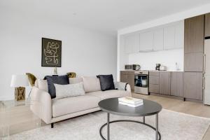 a living room with a couch and a table at Central Sq 1BR w WD nr Central Sq T BOS-615 in Cambridge +13 photos