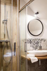 a bathroom with a sink and a mirror at Stara Kuźnia in Łuków