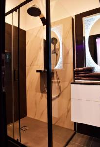 a bathroom with a shower with a glass door at Apartment Turbo - with terrace, AC & WiFi in Zaprešić
