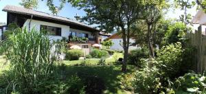 a house with a garden in front of it at Am Schmuggerbühl in Bodenmais +16 photos