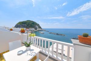 a balcony with a view of the ocean at Hotel Casa Celestino in Ischia