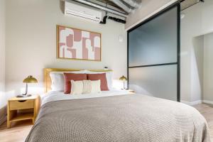 a bedroom with a large bed and a glass door at Downtown 1BR w Gym WD walkable location SEA-48 in Seattle