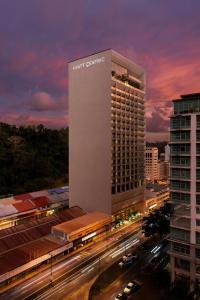a large building with a sign on the side of it at Hyatt Centric Kota Kinabalu in Kota Kinabalu