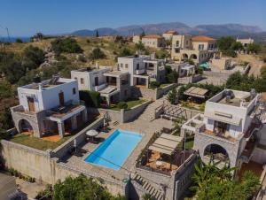 an aerial view of a house with a swimming pool at Malvazios Villas #4 in Gythio