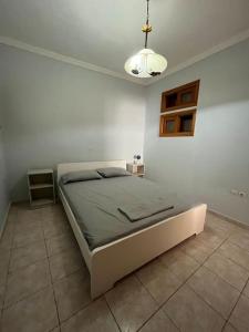 Postel nebo postele na pokoji v ubytování Lixouri Center Apartment