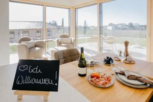a dining room table with a sign that reads wild wilderness at Weinberg Chalets in Malsch